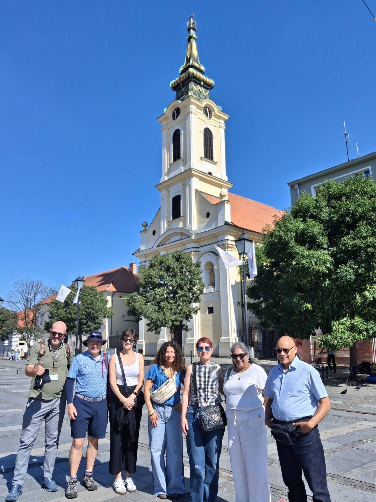 Konstantin and visitors standing in front of Belgrade's cathedral